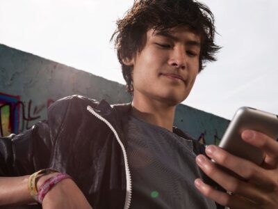Teenage boy using mobile phone